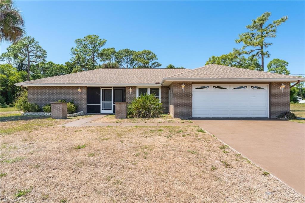 Enjoy "Peaceful Easy Living" on your 1 Acre lot which is conveniently located to central Lehigh. This Brick Home is virtually maintenance free. All windows and sliders are Impact resistance glass. New A/C installed in 12/21.  There is a R/O system in the kitchen and Water filtration equipment in the out building. this home is  conveniently located near shopping Plazas with quick access to Lee Blvd. Williams Ave, Joel Blvd and State Rd 82.
Don't Loose out on your Slice of Paradise.