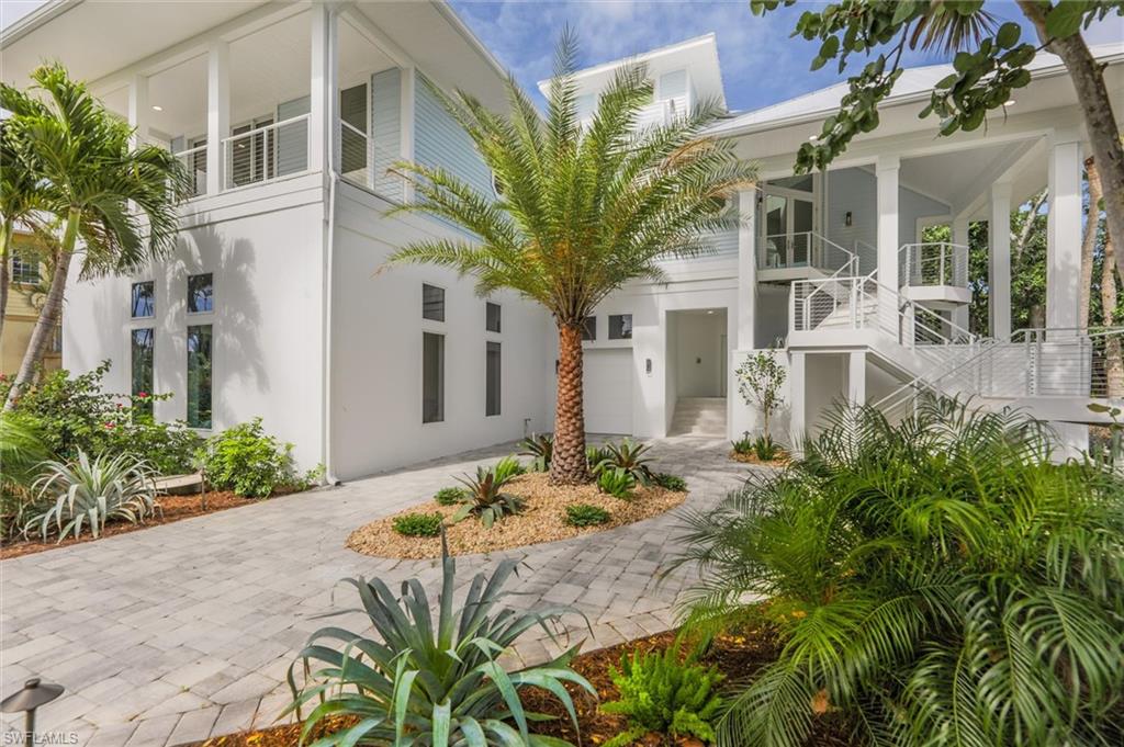 Rare opportunity to purchase a luxurious Gulf Front Estate on Captiva Island within the gated resort community of South Seas.  This stunning, coastal 5 bdrm property offers 102' of beach frontage w/ breathtaking sunsets and views of the gulf.  Totally renovated and remodeled with new quality craftsmanship and attention to every detail.  All new interior furnishings and amenities include, striking quartzite countertops and custom solid wood cabinetry in the kitchen, coffee bar & primary bathroom, beautiful wide plank wood floor throughout, custom ceiling details, private elevator, laundry w/ lots of storage, powder bath, electric blinds and designer furnishings.  The spacious kitchen features a gas Wolf range, beverage cooler, refrigerator, freezer, microwave and dishwasher.  Gorgeious views of the beach from the kitchen, dining & great room.  The penthouse style primary bedroom features a sitting area, laundry, beautiful bathroom and private deck over look the beach which is perfect for enjoying a morning cup of coffee or evening star gazing with a tropical beverage.  Multiple sets of sliders lead to a huge outdoor deck featuring an elevated swimming pool.  The structure has concrete pilings, a new standing seam metal roof, impact glass throughout, expansive circular driveway with pavers, tropical landscaping with pops of color and strategically designed low voltage lighting.  There is an oversized 2 car garage with room for bikes, beach & fishing gear, a separate golf cart garage, and an epoxy finish on the floor.  The bonus area (non-conforming) is fun for guests and a nice addition to the home.  After sun and fun, enjoy the refreshing outdoor shower for a quick rinse before splashing in the pool.  This home has it all ~ location and lifestyle.