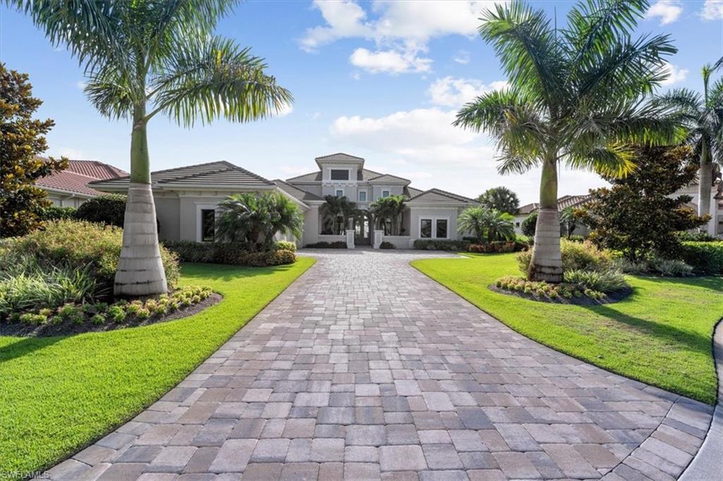 H6277- This stunning home checks all the boxes on your wishlist! Fabulous water/golf views, split floor plan, newer build, large lanai and bright and sunny interior that is just the right size. Not only is it located on a premier south-facing lot at the end of a private cul-de-sac, this home also presents stunning lake and golf course views. With 18’ vaulted ceilings, the professionally designed and well-appointed home offers a generously sized gourmet kitchen with separate island and a butlers pantry/wet bar opening to an inviting formal dining room. The open, airy family room is the heart of the home with impact glass sliders to enjoy indoor/outdoor living. Indulge yourself in the spectacular master bedroom located in its own wing with a thoughtfully designed master bathroom and pretty views of the lake. All en suite bedrooms are generous and one offers a multi-purpose flex room. The expansive lanai with travertine decking and cypress wood ceilings provides generous covered areas featuring a gathering area with fireplace, dining area, well-equipped outdoor kitchen and tons of space to enjoy the sun or shade. Countless upgrades include a whole-house generator and much more.