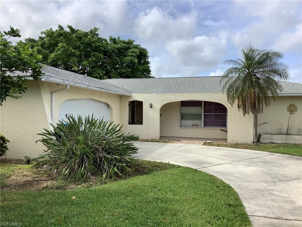 Great SE Location!  Country Club area off Palm Tree Blvd.  Over 1725 sq ft, 3 bedroom, 2 bath home on a corner lot.  Separate living and family rooms.  Family room has vaulted ceiling. Kitchen is spacious with nice sized breakfast bar.  Huge screened lanai across the back of the house. Large side load, 2 car garage.
