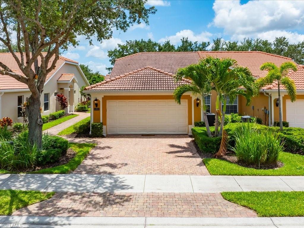 One or more photo(s) has been virtually staged, AI generated or rendered.  Welcome to Tuscany Cove, one of North Naples most desirable gated communities! This 3 bedroom, 2 bath, pool home with 2 car garage offers the perfect blend of comfort, convenience, and Florida Lifestyle Living. Enjoy your private pool area overlooking the lake with sought after Southern exposure, providing abundant natural light throughout the day and the perfect setting for relaxing or entertaining outdoors. Inside, the open and inviting floor plan with vaulted ceilings features a new A/C system, new stove, dishwasher, and microwave. The spacious primary suite and well appointed guest bedrooms provide plenty of room for family and friends. Located in the gated Tuscany Cove community, residents enjoy resort style amenities, including a clubhouse, community pool, fitness center, tennis courts, pickleball, a basketball court, playground, and more. Tuscany Cove is conveniently located near Naples beautiful beaches, shopping, dining and I-75. This pool villa is an exceptional opportunity to enjoy the best of Southwest Florida Living!