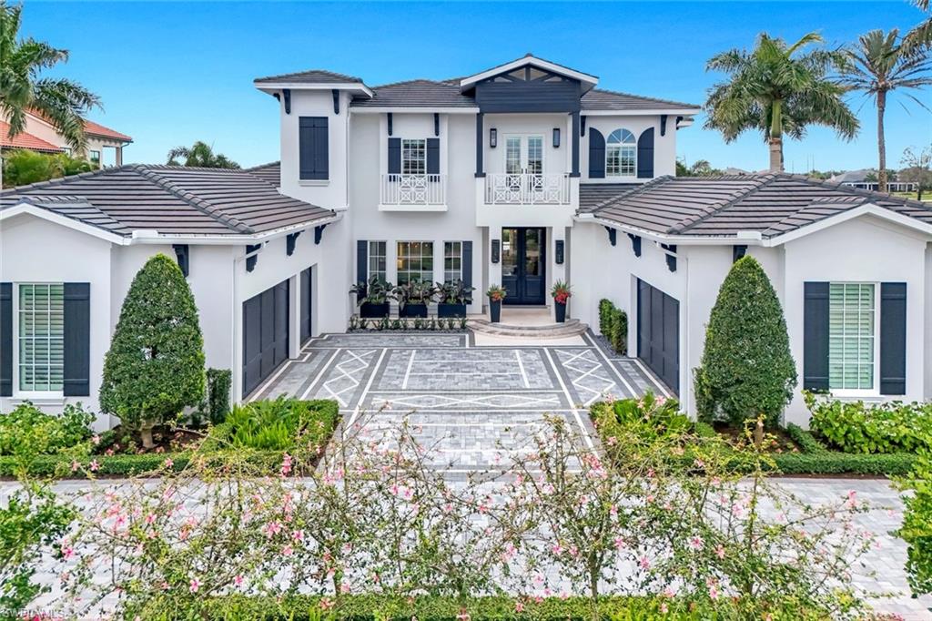 FULL GOLF MEMBERSHIP AVAILABLE — Welcome to 16744 Prato Way, an exceptional residence nestled within the prestigious gated golf course community of Talis Park in Naples, Florida. This home offers five bedrooms plus a den and a generous bonus room, complemented by five full ensuite bathrooms and two half baths. Refined modern coastal decor throughout, the home is offered with beautifully curated furnishings that are negotiable. A whole house generator provides added peace of mind, and the convenience of two laundry rooms and an elevator enhances everyday living. This elegant home showcases refined architecture, sophisticated finishes, and a seamless blend of indoor and outdoor living. Thoughtfully designed with an open-concept floor plan, the residence features expansive living spaces filled with natural light, soaring ceilings, and designer details throughout. The gourmet kitchen is beautifully appointed with premium appliances, custom cabinetry, and an oversized island ideal for entertaining. The primary suite offers a private retreat with spa-inspired bath amenities and generous walk-in closets. Step outside to an outdoor oasis, where a covered lanai, resort-style pool and spa, and serene golf course views of three different fairways create the perfect setting for relaxation or hosting guests. Residents of Talis Park enjoy world-class amenities, including a championship golf course, vibrant clubhouse, fitness center, spa, tennis and pickleball courts, and fine dining — all within minutes of Naples’ renowned beaches, shopping, and dining destinations. An extraordinary opportunity to experience luxury living in one of Naples’ most sought-after communities.
