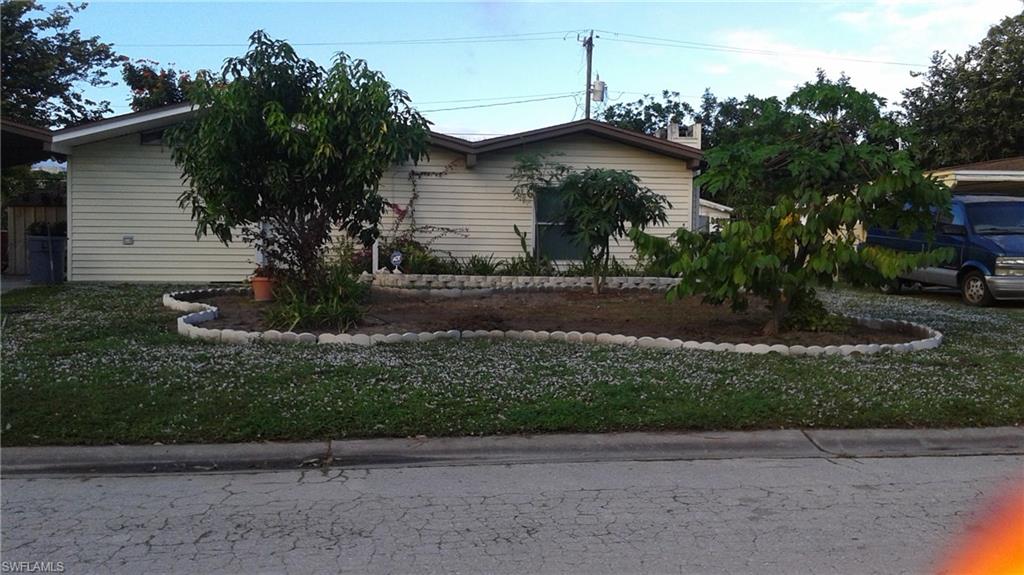 Comfortable, lush Tropical garden retreat in convenient Bowling Green neighborhood. From the moment you open the front door, you'll feel like you've arrived "home". You'll experience the open floor plan living room, dining room and family room with fireplace, high ceilings and crown molding. You can choose to make yourself at home in front of the TV or the fireplace. Or go to the rear of the home and sit by the solar heated pool or jump in the hot tub and relax and enjoy the tropical garden. The entire backyard is made private by a fence as well as lush landscaping consisting of bananas, mango, avocado, moringa, sugar apple, night blooming jasmine, aloe and papaya to name a few. This home has been remodeled with numerous upgrades including electrical, AC ducts, storm shutters, security system, outdoor sheds and so much more.
