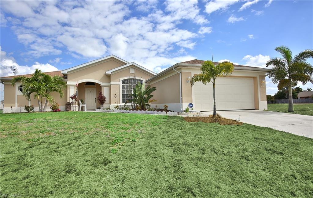 Nice!  Beautiful home conveniently located off Chiquita Blvd just minutes to schools, and also the restaurants, shopping, businesses on Pine Island Rd.  3 Bedroom 2 Bath home with open floor plan.  Granite counter tops, stainless appliances, vaulted ceilings.  Tile floors throughout most of the home with carpeting in the bedrooms.  Kitchen overlooks the living area, great for entertaining.  Screened in lanai with plenty of room for pool. Nicely landscaped corner lot.