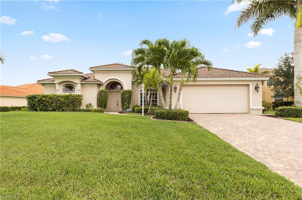 Wonderful Cape Royal Pool Home overlooking Golf Course. This amazing home features 3 bedrooms, 2 baths with 2242 sq ft of air conditioned living space. The great room floor plan is well laid out and offers privacy as well as easy access to the large pool deck. The spacious master suite features a luxurious master bath with a large soaker tub as well as shower and separate dual vanities. The suite also offers a private WC and a large walk in closet. The large living room has a wood design feature adding warmth and elegance to the large space which is open to the dining room. In the kitchen you will find wood cabinets with granite counter tops and stainless steel appliances. The breakfast nook overlooks the pool and golf course. There is privacy for the two guest bedrooms and guest bath, with an easy access to the pool deck without having to pass thru the living area. The inside laundry room connects the home to the 2 car garage. Enjoy the Florida lifestyle on your large pool deck and heated pool. Some other elegant touches are the pavered driveway, Royal Palm lined front, creative accent walls, tile floors everywhere except the bedrooms.
