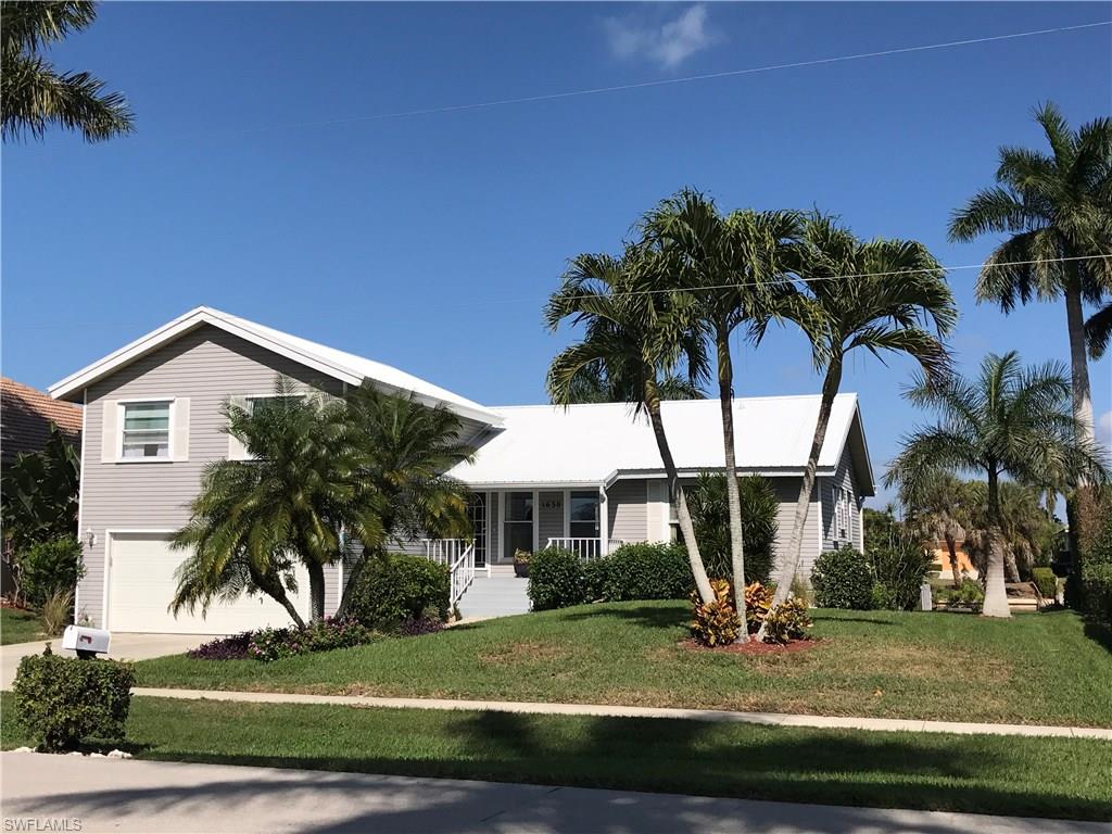 Well maintained and loved home. This comfortable home has two full master suites. The upstairs suite can be closed off for maximum privacy. The other bedrooms are quaint and on a split floorplan. Relax on the front porch or enjoy the rear yard deck. An outstanding home for a large extended family or for entertaining family and guests. Great water access exiting through Roberts Bay toward Florida's Ten Thousand Islands and outstanding fishing opportunities. Great boat dock and lift for your own boat. You have to see this one!