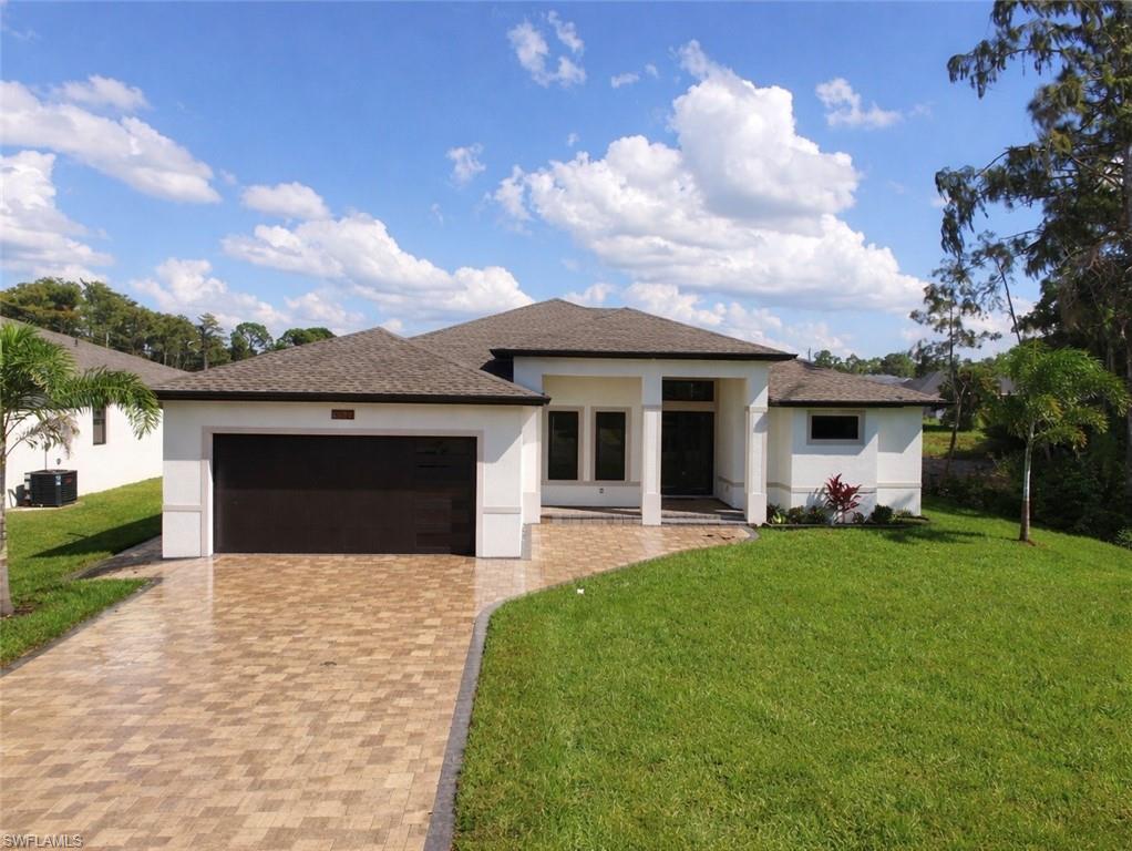 Step into this custom-built home just shy of 2,000 sq. ft. of living space and nearly 3,000 sq. ft. total, this thoughtfully designed home offers the perfect blend of luxury and practicality. From the start you're greeted with an upgraded pavered driveway with substantial lighting from the soffit down lighting. Take a step inside to discover Level 4 granite countertops throughout, hurricane impact windows and doors, and a spacious two-car garage with sleek epoxy flooring. But we're not done there, the gourmet kitchen features rare appliances such as, an oversized refrigerator, electric cooktop, and a microwave/wall oven combo—ideal for culinary enthusiasts. Adjacent to the kitchen, a stylish dry bar doubles as a coffee or wine station, completing the dining experience. The master bedroom is equally as impressive, equipped dual walk-in closets, dual sinks in the bathroom, a tile-accented bathtub wall, and a walk-in shower enclosed by a glass door. Outdoors, enjoy a large, screened lanai with tile flooring, complete with an outdoor kitchen and space for your choice of grill. There’s substantial room to add a pool, making this home perfect for entertaining. Outside there is also a dedicated door from the lanai to the bathroom which makes hosting gatherings seamless. Additional highlights include a fireplace insert for cozy evenings and a laundry room that includes a built-in counter for added convenience. Seller is offering $5,000 towards buyers closing costs.