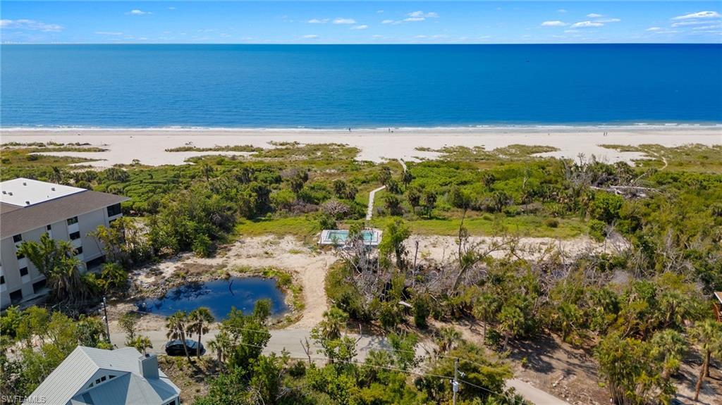This is the site of the former Clamshell condominium complex which was comprised of six units, three, three-bedroom units and three two-bedroom units, a large pool and private boardwalk. This was all along the beach and Gulf of Mexico. The buildings have been taken down and the pool shell remains. The parcel offers 300 feet of beach frontage and approximately 2.54 acres of land. Zoned multifamily the subject property has a designated zoning categorization, as follows: D-1 (Lowlands Wetland Zone), E-2 (Gulf Beach Ridge) and A (Gulf Beach Zone). Many redevelopment options exist where the new properties would feature beach frontage and stunning views. On Sanibel Island between the well-known condominium complexes of Sand Dollar and Signal Inn, this parcel is close to it all including an 18-hole golf course, shops, restaurants, resorts and along Sanibel's scenic bike paths. This is your chance to be a part of the rebuilding of Sanibel Island.