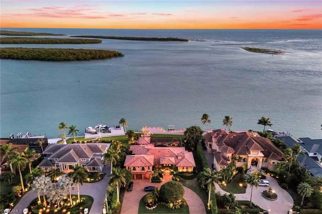Spectacular residence located on Marco Island’s most prestigious street address…Caxambas Ct. This impeccably maintained and thoughtfully nurtured home, has been upgraded multiple times over the years. Home is nestled on one of the premier homesites in all of SW Florida. It includes 4 bedrooms, 4 baths, media room, office & den areas, butler’s pantry, etc., Imported Canadian stone & wood floors, beautiful finishes throughout. The pool area is your very own private oasis. It features a covered sitting area, with kitchen, wet bar, fireplace, and inlaid wood plank ceiling. There’s also an additional poolside gazebo. Approximately 100 ft of impressive docking space for whatever yacht or watercraft you might desire. Very deep water right at your 2 yr old seawall. Then there are the incredible, jaw dropping views. Ideal SW exposure that takes in Caxambas Pass, the Ten Thousand Islands and the Gulf. Your boating access is immediate. Catch your breakfast, lunch and dinner from your dock or sit and watch the dolphin & manatee roll by. Words simply don’t do this wonderful home justice.