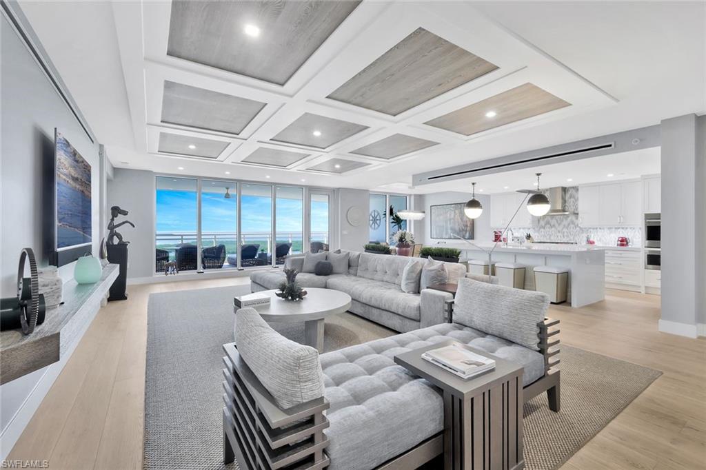 Unique opportunity to own in one of Naples' most sought after communities!  Coastal living embodied at its finest in this turnkey furnished unit featuring some of the most spectacular views found in Southwest Florida!  From the minute you walk thru the private elevator entrance, you will be impressed with the elegant coastal chique appointments, custom designer finishes, and carefully thought out built-ins.  No detail has been left out!  3 bedrooms and a den that can be used as a 4th bedroom, 3.5 baths.  Hurricane shutters are in place on the main lanai, for peace of mind and no need to move furniture in and out.  The main lanai is over 500 square feet of room for relaxing and watching stunning sunsets.  Take your private elevator to the roof, and jump in the rooftop pool, or enjoy your open air fitness- all features unique to Kalea Bay.  Downstairs, 5 star amenities await- The Club at Kalea Bay is second to none with two restaurants, two outdoor bars, guest cottages, and a state of the art new 14,000 sq foot wellness center.  Kalea Bay is the finest in Naples luxury waterfront living, and this unit is ready to enjoy right now, no wait.  Don't miss it!
