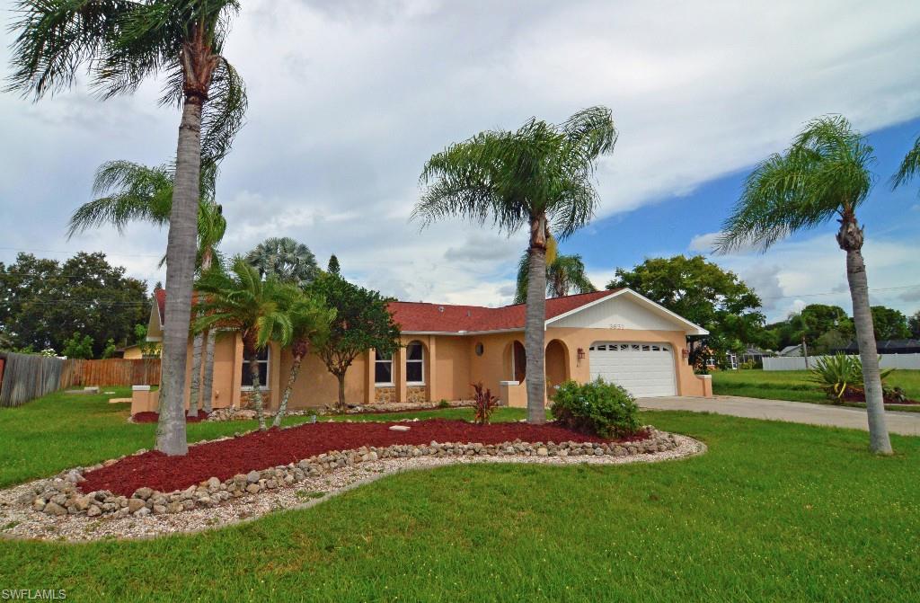 Amazing features throughout! Wonderful 3 bedroom 2 bath home with split floor plan and vaulted ceilings. This home feels large and open with it's vaulted ceilings plenty of natural light and lovely tiled and laminate floors throughout. The kitchen features Kitchen Craft cabinets with pull outs, granite counters, tile backsplash, and stainless steel appliances. There is also a pass through window to the lanai for entertaining. Large master bedroom features his and her closet with built in storage and creates a large mirrored wall, master bath can double as a future pool bath with access to the lanai. Guest bedrooms are warm and bright with a guest bath that features a tub and granite vanity. In home laundry room with newer front load washer dryer, spacious garage with work bench and cabinets, beautifully landscaped front/back yards with room for a pool. Irrigation, 2 shed pads, outdoor lighting, screened lanai, even concrete curbing everywhere, oversized driveway with sidewalk to rear of home. Did I mention all assessments paid! Newer roof, re-plumbed, and ready for new owners. Do not miss out on this wonderful opportunity to be minutes from everything in a peaceful neighborhood.