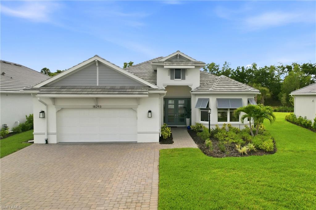 Experience the perfect blend of luxury and coastal elegance in this beautifully upgraded 3-bedroom + den, 3-bath residence offering 3,125 square feet of thoughtfully designed living space in the highly sought-after Esplanade Lake Club.

From the moment you arrive, you'll appreciate the extended driveway, three-car tandem garage, and exceptional curb appeal. Inside, sophisticated finishes and gorgeous designer updates create a warm, inviting atmosphere. The open-concept floor plan showcases premium Monogram appliances, impact-resistant windows and doors, natural gas cooking, and beautiful flooring throughout with no carpet.

The spacious primary suite is a true retreat featuring a charming bay window, a custom-designed walk-in closet, and a luxurious spa-inspired bath. A second bay window enhances the front guest bedroom, the thoughtfully designed 3rd bedroom is enhanced with an ensuite bath,  while the versatile den offers the perfect space for a home office, media room, or additional guest accommodations.

Every detail has been considered, including custom wood shelving in the closets, a well-appointed laundry room with cabinetry and utility sink, and abundant storage throughout. Step outside to the expansive lanai, already pre-plumbed and pre-wired for your dream outdoor kitchen and pool, where the coveted western exposure provides breathtaking sunsets over your future backyard oasis.

Located within the award-winning Esplanade Lake Club, residents enjoy an unparalleled resort lifestyle with a stunning resort pool, private beach, boating and lake access, tennis and pickleball courts, the popular Bahama Bar waterfront restaurant, a café and coffee shop, a full-service spa, an attended fitness center offering a wide variety of classes, two dog parks, and an active social calendar filled with clubs and events.

Conveniently located just minutes from Southwest Florida International Airport (RSW), Florida Gulf Coast University (FGCU), shopping, dining, entertainment, and Gulf Coast beaches, this exceptional home offers the perfect combination of luxury, convenience, and the Southwest Florida lifestyle you've been dreaming of.