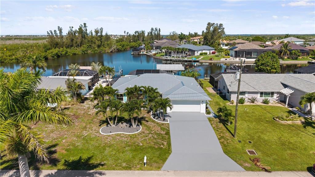 Waterfront Paradise in Matlacha Isles – Sailboat Access, Pool/Hot tub & Dual Boat Lifts
Experience the ultimate Southwest Florida waterfront lifestyle in this beautifully positioned 3-bedroom, 2.5-bath home in the highly sought-after Matlacha Isles. Offering just under 2,000 square feet of living space, this exceptional property sits on an intersecting canal with coveted western exposure, delivering spectacular sunset views from your own backyard oasis.
Boaters and anglers will appreciate the direct sailboat access with no bridges and quick access to the Gulf of America. Two covered boat lifts provide convenient high-and-dry storage for multiple vessels, making it easy to enjoy some of the world's finest fishing waters whenever the mood strikes.
The outdoor living area is designed for relaxation and entertaining, featuring a sparkling pool, soothing hot tub, and expansive waterfront views. Whether you're hosting family and friends or enjoying a quiet evening watching the sunset, this home captures the essence of coastal living.
Located on a peaceful cul-de-sac in a quiet neighborhood, you'll enjoy privacy while remaining just a short boat ride from the vibrant waterfront dining and island charm of Matlacha, Bokeelia, and St. James City.

Property Highlights
3 Bedrooms | 2.5 Bathrooms
Just under 2,000 sq. ft. of living space
Sailboat-access waterfront location
Intersecting canal with western exposure
Minutes to the Gulf
Two covered boat lifts
High-and-dry boat storage
Private pool and hot tub
Cul-de-sac location in a quiet neighborhood
Short boat ride to waterfront restaurants and island destinations
Outstanding fishing and boating opportunities

This is a rare opportunity to own a premier waterfront home that perfectly combines boating convenience, outdoor living, and the laid-back island lifestyle that makes Matlacha Isles one of Southwest Florida's most desirable boating communities.