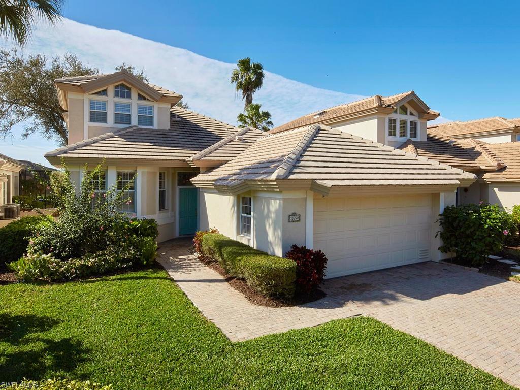 V. 2947 - Enjoy relaxing days in this meticulously maintained two story open floor plan villa with an expansive golf view and a sunny southwest exposure. Enjoy a wonderful open and airy Great Room floor plan with volume ceilings. Features include: 3 bedrooms, 2.5 baths, updated kitchen with custom cabinets and granite countertops, plantation shutters, new carpet throughout main living areas and new sundeck off master bedroom. All bathroom vanities newly replaced with quartz countertops. Screened in lanai with sun deck provides a wonderful entertaining area. This model perfect home is available for your immediate enjoyment. Turnkey furnishings available separately with some Exclusions. Roof replaced in 2004. Upstairs AC replaced in 2015, Ground Floor AC in 2016.  4 sets of impact resistant sliding glass doors.  Driveway, sidewalk and outdoor entertaining area are finished with stylish brick pavers.  2-car garage. The Enclave community has its own swimming pool a short walk away.  Enclave is close to the Club and the main entrance to Bonita Bay. Landscaping and community pool are the responsibility of the HOA.