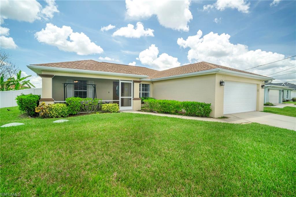 Welcome to this exceptionally maintained 3-bedroom, 2-bathroom home with a 2-car garage, ideally situated on a quiet dead-end street with intersecting canals in desirable Lehigh Acres. From the moment you arrive, you'll appreciate the inviting screened front porch and an upgraded front entry door. Inside, this move-in ready home features luxury vinyl plank flooring throughout the main living areas, tile flooring in the wet areas, upgraded lighting and ceiling fans in every room, elegant 5-inch baseboards, and beautiful Level 5 granite countertops. The spacious kitchen is equipped with stainless steel appliances, and the washer and dryer are included along with a transferable 1-year Best Buy service plan for added peace of mind. 
Step outside to your private backyard retreat featuring a white vinyl privacy fence, screened lanai, custom-built wood deck, patio area, and a 6-person hot tub installed in 2023—perfect for entertaining or relaxing after a long day. The lush Floratam lawn is maintained with an automatic irrigation system. Additional features include a laundry room with extra cabinetry and storage closet, automatic garage door with MyQ smart automation, Ring security system with cameras, manual hurricane shutters for all windows and sliding glass doors, gutters around the entire home, and a GenerLink whole-house generator switch already installed. Major updates and maintenance items have already been completed, including a new well pump (2025), well equipment replacement (2022), drain field replacement (2024), roof replacement (2017), and years of professional HVAC servicing and maintenance. The interior and exterior have also been freshly painted, making this home truly move-in ready. This meticulously cared-for property offers the perfect combination of comfort, upgrades, and peace of mind. Schedule your private showing today and see everything this exceptional home has to offer!