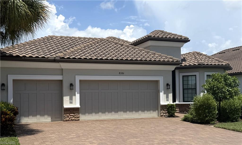 Discover the perfect blend of luxury, comfort and an active resort lifestyle in this stunning 3 bedroom plus den 3 bath pool home. Located within a vibrant, highly social gated community, this property offers an unparalleled living experience just minutes from SW Florida's finest attractions. The heart of the home features a modern kitchen in this open concept floor plan. Bonus features include California closets in the primary walk-in closet, a whole house Kohler generator, sparkling private pool, a rare 3 car climate-controlled garage, a screened lanai with electric roll down hurricane shutters, new impact resistant sliders, outdoor kitchen, a wine refrigerator and so much more. Community amenities include a lap pool, resistance pool, community hot tub, exercise room, game room, bocce ball, pickle ball and tennis. Located minutes from I-75, 20 minutes to Marco Island and 20 minutes to downtown Naples. Shopping, dining and recreation facilities are nearby. Whether enjoying quiet mornings or hosting sunset dinners, this home delivers the best of Florida Living.