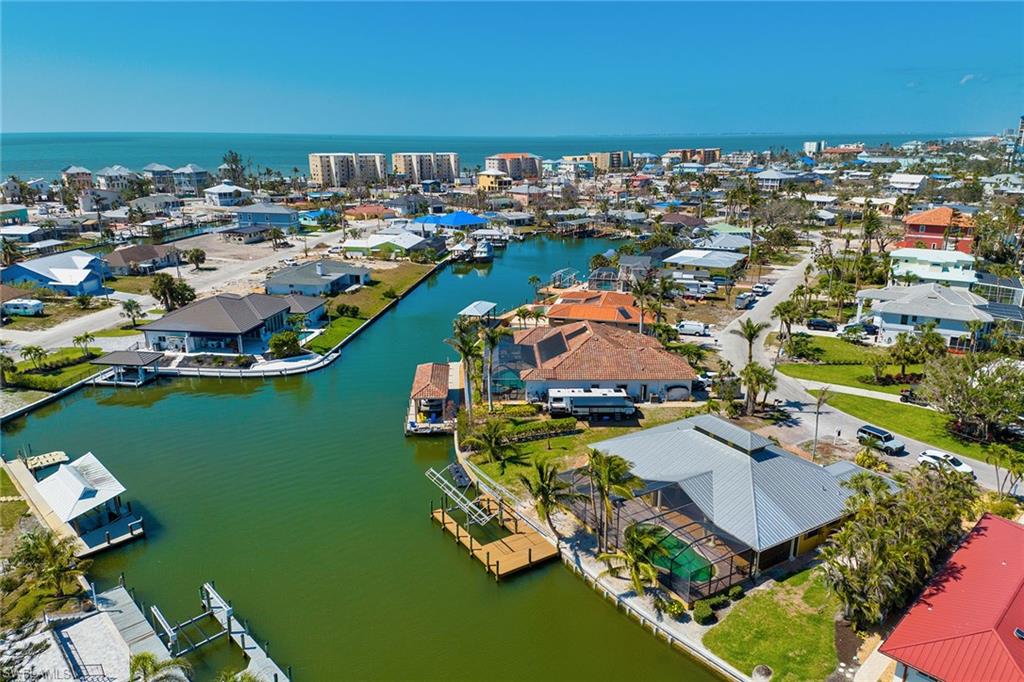 Deep-water, Gulf-access waterfront home that is just minutes to the beach — who says you can't have it all? Imagine relaxing on your extended dock while dolphins and manatees play in the water with a view of the Estero Bay beyond. A boater's paradise, this home with three bedrooms and three-and-a-half baths is located on one of the deepest canals on the island. Previously renovated, the open design, high ceilings and walk-in closets create the perfect canvas for your new home. Fully remediated with a completed structural and electrical inspection, this home features new HVAC, a new electrical panel, a newer pool heater and hurricane windows, along with an operating boat lift and rebuilt sea wall. Now is the time to take advantage of this incredible opportunity to own in the desirable mid-island location of Glenview on Fort Myers Beach.  Note that photos showing renovations and furnishings are virtual photos for reference only.