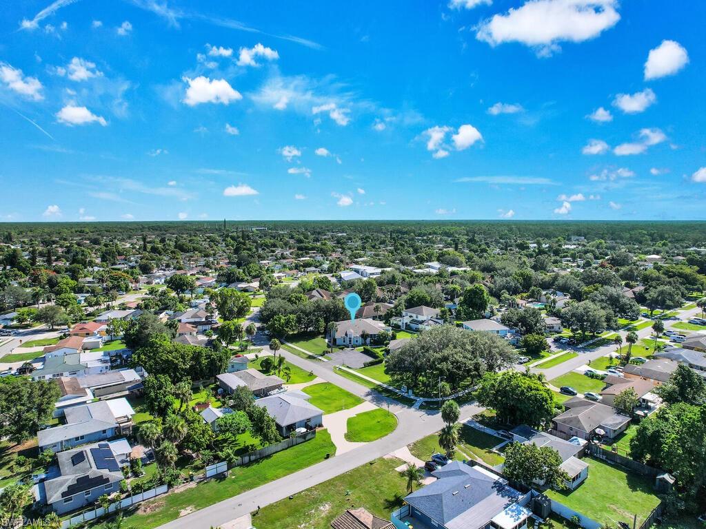 Fantastic low maintenance SWFL living with impact windows! The villa is situated in a deeded non-gated community that is only a short walk to community park, right around the corner from the Courtyard at Golden Gate community pool, less than half hour drive to the beach, close to public golf courses, and surrounded by tons of shopping & dining options. Quad designed building with assigned parking, screened front entry & long side screened lanai overlooking a spacious yard area, great room layout, split bedroom floor plan, updated kitchen, and laundry room with lots of storage space. This home is ideal for seasonal or annual Florida living, plus it offers affordable condo association fees. Highly desired Naples location!