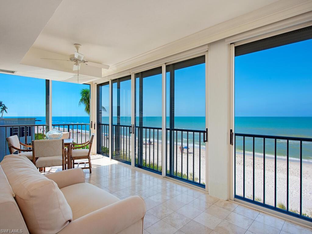 Experience breathtaking views and captivating sunsets from this highly desirable and rarely available 3rd floor condominium in The Gramercy. With only 24 private residences, and only eight in the west stack, this exceptional unit offers 3 bedrooms + a den, 3.5 bathrooms, and a total of 3,297 sq ft. The great room features an open concept design, flowing out to the lanai. Adjacent to the formal dining area is a wet bar with a wine refrigerator and ice maker. A den off the kitchen provides space for relaxation or work. The primary bedroom en-suite boasts his and her bathrooms and dual walk-in closets. The purchase of this unit includes a private Cabana, with a west-facing orientation and close proximity to the beach access. Additional highlights include impact glass, electric shutters, extra enclosed storage, and one assigned covered and deeded parking space. The Gramercy offers high-end amenities including a community pool, social room, BBQ area, fitness room, patio with fire pit, welcoming lobby area, bike and kayak storage, and beach access with professional on-site management. The Gramercy is just a short walk to Venetian Village and central to all that Naples has to offer.
