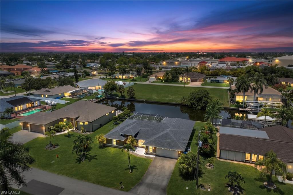 Live the ultimate Southwest Florida boating lifestyle in this beautiful 3-bedroom, 2-bath Gulf access pool home with **no bridges** to open water! Whether you're heading out for a day on the Gulf or relaxing poolside, this home offers the perfect blend of comfort and waterfront living. New dock and boat lift included in the price.

Inside, the open floor plan features a spacious living room, formal dining area, and a large eat-in kitchen complete with stainless steel appliances, a breakfast bar, and abundant cabinet and counter space—ideal for both everyday living and entertaining.

The expansive primary suite is a peaceful retreat with sliding glass doors leading to the screened lanai. The ensuite bathroom features a dual sink vanity, relaxing soaking tub, separate walk-in shower, and ample space to unwind. Two additional guest bedrooms provide comfortable accommodations, while the second bathroom conveniently doubles as a pool bath with direct access to the lanai.

Step outside to your private outdoor oasis featuring a screened lanai with a covered under-truss seating area overlooking the sparkling pool and Gulf access canal. The fenced backyard provides privacy and space for pets or outdoor activities. Boaters will appreciate the direct Gulf access with **no bridges**, making every trip to open water quick and convenient.

Additional peace of mind comes with a **new roof installed in 2023**. This exceptional waterfront home is the perfect opportunity to enjoy everything Southwest Florida has to offer.