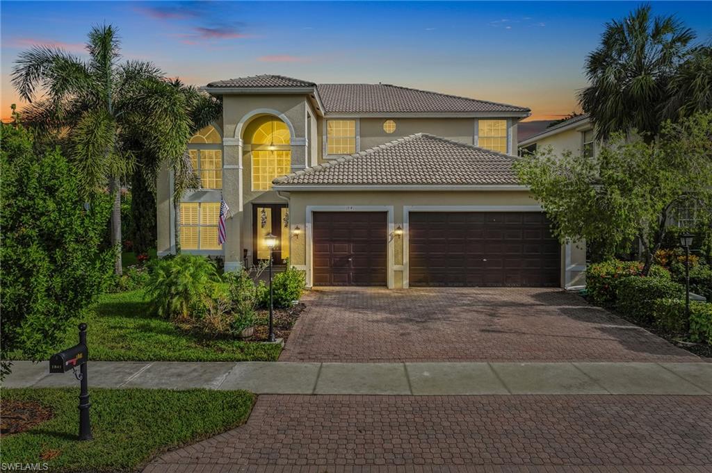 One or more photo(s) has been virtually staged, AI generated or rendered.  WELCOME TO EFFORTLESS LUXURY in one of Naples' most sought-after communities, Saturnia Lakes. This beautifully designed 4 bedroom + den, 3.5 bath residence offers over 4,000 square feet of thoughtfully curated living space perfectly situated on a premium, oversized corner lot. From the moment you step through the grand double-door entry, you'll appreciate the soaring ceilings, abundant natural light and seamless flow throughout the home. Rich hardwood flooring, custom millwork and designer finishes create a warm yet sophisticated atmosphere. The heart of the home is a chef-inspired kitchen featuring granite countertops, custom cabinetry, a large center island, premium appliances and generous prep space, perfect for everything from casual family dinners to entertaining on a grand scale. The spacious primary suite is an exclusive retreat, complete with a sitting area, spa-like ensuite bath and custom walk-in closets designed for both style and function. The screened lanai w/ coveted southern exposure, creates an all-inviting outdoor living space with multiple areas to relax and entertain, including a refreshing pool, large enough to swim laps and a secluded landscaped backyard providing exceptional privacy. Whether you're enjoying your morning coffee or hosting friends for an evening gathering, this outdoor living space is designed to be enjoyed year-round. Additional highlights include a spacious three-car garage, two large stone fireplaces and quality craftsmanship throughout. Residents of Saturnia Lakes enjoy a resort-inspired lifestyle with exceptional amenities, including a clubhouse, resort-style pool and spa, fitness center, tennis courts, billiards, walking paths, playground and a full calendar of community activities.....all within a gated community conveniently located near Naples' premier shopping, dining, golf, and sandy white beaches. This is more than a home….it’s an opportunity to experience the very best of Southwest Florida living.