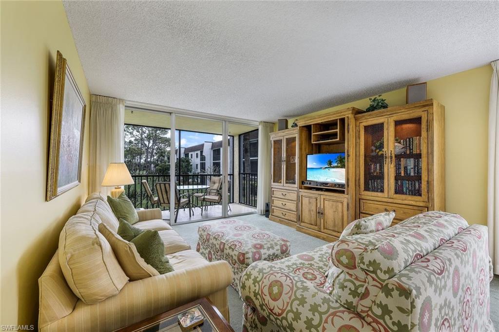 THIS is the ONE you’ve been waiting for!  If you are searching for your winter getaway, for your permanent Florida home, or the IDEAL investment opportunity...This 2BR/2BA unit will NOT disappoint.  Located MINUTES from Downtown Bonita Springs, this Bonita Pines END unit offers a spacious kitchen with plenty of counter space for preparing your favorite meal, dining area to relax while sip your morning coffee, and a lanai with the perfect view to enjoy your evening cocktail. PLUS, this unit comes with a COVERED parking space AND is only STEPS from the pool. Bonita Pines offers tennis/pickleball courts, community pool, basketball courts, and SO MUCH MORE!  Only a short bike ride to Downtown Bonita's coffee shops, wine bars, breweries, restaurants, art fairs, food truck park, festivals and more AND less than a 10-minute drive to the FAMOUS Barefoot Beach. You DO NOT want to miss your opportunity to see this perfectly located home in Bonita Springs!