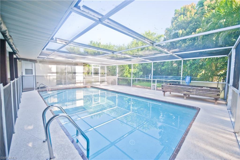 Fantastic home, established neighborhood! This three bedroom two bath home could easily be used as a four bedroom -  the den already has a closet, a window, and a door.  Fantastically large covered lanai overlooking your swimming pool which is solar heated and just waiting for you to take a dip.  Split bedroom floor plan. The two guest rooms share a huge closet, with both of them having access.  Master bedroom features a custom closet and sliders to your huge Lanai. The sellers love this home and it shows, no deferred maintenance here! Roof and solar heating replaced in 2006, hurricane screens installed 2006, generator & required wiring installed 2006, house was re-plumbed into 2007, most appliances replaced since 2012, deck redone in 2014, new ceiling fans in bedrooms, new pool pump (2017), new garbage disposal (2017), new garage door opener (2016). Hurry this is priced to sell!