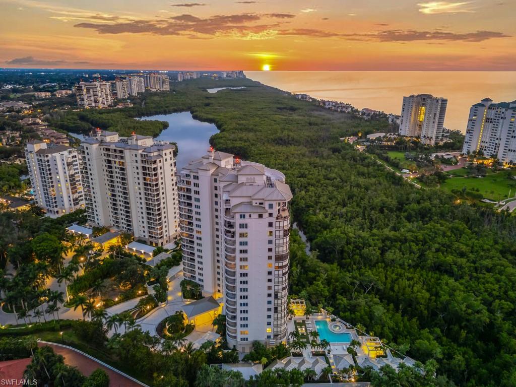 Seamless, Sophisticated and Sunset-driven. Welcome to Salerno 703, a designer remodeled three-bedroom, three-bath residence in the prestigious gated enclave of Bay Colony. Western exposure bathes this home in golden afternoon light and captures breathtaking sunsets over the Gulf, a dynamic backdrop that transforms from day to night. Thoughtfully reimagined for today’s modern coastal lifestyle, the Wall between the kitchen and living room has been removed to create a Grand open-concept Great room where architecture disappears and the views take center stage. At its center, an exquisite marble peninsula anchors the space creating a stunning focal point and natural gathering place. Generous in scale, it offers ample seating for casual dining or elegant entertaining and provides additional storage and convenient Sub-Zero refrigerator drawers. Best-in-class Kitchen Appliances, Wolf, Sub-Zero and Miele offer culinary performance while showcasing sleek contemporary design and are highlighted by beautiful custom crafted cabinetry by Downsview. The spacious primary suite is a private retreat, while two additional guest bedrooms and full baths provide comfort and privacy for family and friends. The Salerno boasts a fully updated lobby level—an elegant transformation that sets a new standard for refined living. A professionally staffed concierge greets you upon arrival, while the beautifully designed social lounge invites connection and relaxation. You will enjoy a state-of-the-art fitness center, a resort style outdoor pool and dining area and the added benefit of well-appointed guest suites. Beyond the residence, Bay Colony offers a lifestyle reserved for the fortunate few with private beach access and attended service, a tennis center, an exclusive beach club and restaurant and beautifully maintained grounds. As a homeowner, you will further enjoy all the amenities of Pelican Bay, Southwest Florida’s most desired beachfront community.