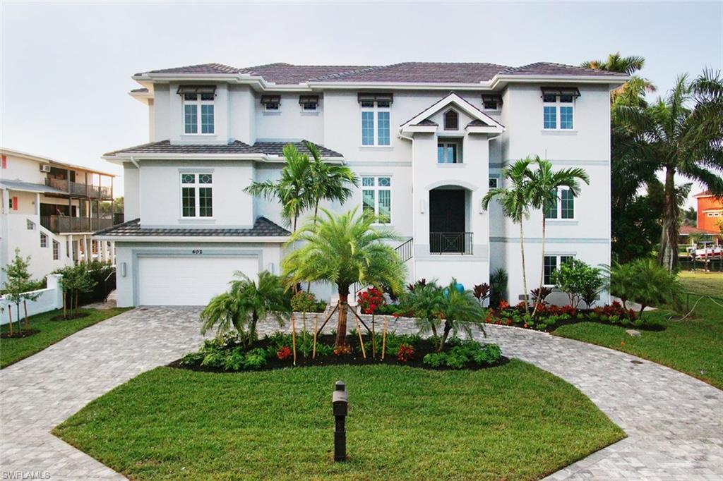 CONTEMPORARY, COASTAL CHIC!  This Vanderbilt beach stunner with 7 bedrooms plus den, 7 full & 2 half baths, is the newest addition to the Vanderbilt Estate Waterfront Homes, creating a perfect marriage of land, water and design.  Located within walking distance to beautiful Vanderbilt beach and only a short distance by boat to the Gulf of Mexico.  Thoughtfully designed with a stunning wall of windows overlooking the canal, Bay & outdoor entertaining area with complete outdoor kitchen, covered patio with elevated pool & spa with sun shelf.  Kitchen offers Thermador appliances, large island, custom tiled back splash & tons of storage space. Second floor provides family room with a 75” Sony 4K television and morning kitchen. Master Suite offers private, covered balcony with a Sunbright outdoor TV, floor to ceiling tile in the Kohler Digital shower, floating double vanity, soaking tub & custom closet system.  Soaring ceilings, designers fans, custom wood plank & stone look floor tile and/or carpet throughout, designer LED lighting, built-in screens and shutters on the lanai, 3 Mega capacity washers & dryers plus tons of storage, electric screens and shutters on the lanais.
