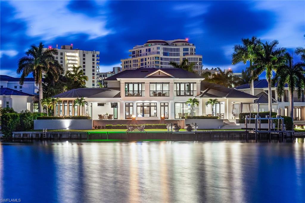 Tucked away in Park Shore, this spectacular residence offers West Indies-styled architecture, sizable square footage and panoramic wide water views from sunrise to sunset. Built by TB Price Builders, this offering separates itself from all others with an unrivaled combination of quality, technology and water frontage. This well-designed floor plan reflects today’s needs, with an open-concept great room, towering detailed ceilings, banks of sliders and French doors that open onto multiple entertaining areas. Epicurean kitchen with Ruffino custom cabinetry, butler’s pantry and top-of-the-line appliances including refrigerated and freezer drawers, 264-bottle glass wine cellar, steam oven and a Wolf gas cooktop. Spacious master suite, with sizable custom closets and marble bath that boasts dual water closets, a large walk-in shower with multiple heads and a soaking tub. The outdoor area offers multiple entertaining spaces with a fireplace, summer kitchen, fire bowls and motorized screens/shutters. Impressive 50-foot infinity-edge pool overlooks wraparound dock featuring water sports platform, boat lift and lounging area. Park Shore private beach membership eligibility.