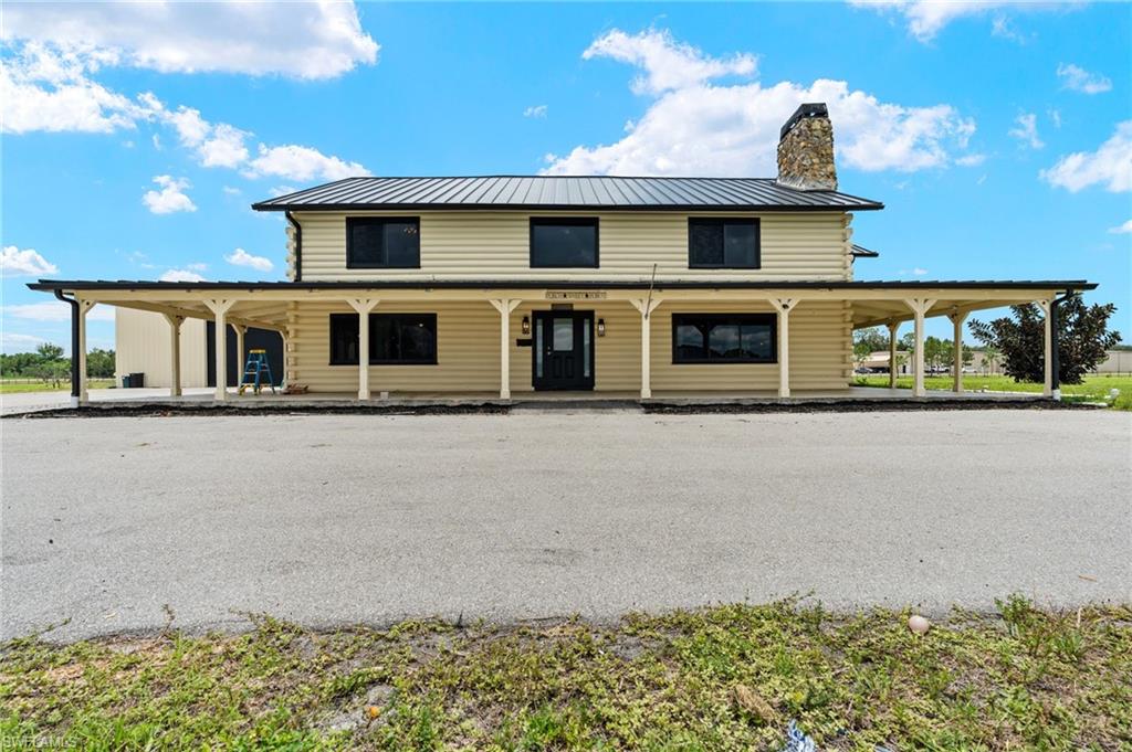 Rare Opportunity to Own a Log Cabin Pool Home on 3.59 Acres, ZONED AG2 with an approx. 3,500 sq ft. warehouse / Man-cave in North Fort Myers.
This one-of-a-kind, Cedar log home with metal roof is situated on 3.59 private acres. Featuring approximately 3,500± square feet of living space, this unique property offers 3 bedrooms plus a flexible office/den that can easily serve as a 4th bedroom or second primary suite, along with 3 full bathrooms. The spacious open-concept floor plan showcases soaring ceilings, natural wood finishes.
The home features a durable metal roof, warehouse, in-ground pool, hot tub and expansive outdoor areas ideal for enjoying the peaceful rural setting. Zoned AG-2, this property provides flexibility for agricultural uses, animals, hobby farming, equipment storage and other permitted business uses. 
Located just minutes from shopping, dining, schools, and major roadways, this property
