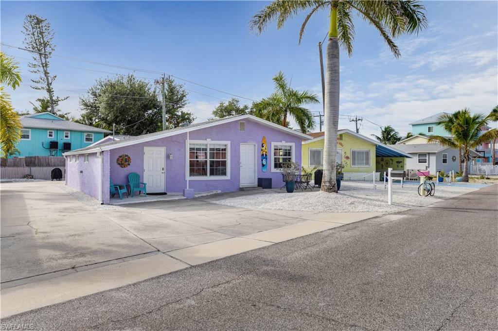 Just a short 5-minute walk to the sugar sand beaches of Fort Myers Beach, this beautifully updated 3-bedroom, 2-bathroom weekly rental property offers the perfect blend of investment potential and coastal living. Located within walking distance of popular restaurants, bars, entertainment, and everything that makes Fort Myers Beach one of Southwest Florida's premier vacation destinations. The property features a bright, open floor plan with updated cabinetry, granite countertops, modern finishes, tile flooring throughout, and renovated bathrooms. An additional detached living space provides flexibility for guests, extended family, or to maximize rental income potential. The oversized detached garage offers ample storage for vehicles, beach gear, golf carts, and all your island toys. Situated on a generously sized lot, this property is ideally positioned to capitalize on Fort Myers Beach's thriving weekly rental market. Whether you're looking for a vacation home, investment property, or both, this location offers exceptional convenience with the beach, restaurants, shopping, and nightlife all just moments away. Don't miss this opportunity to own a turnkey island property in one of Fort Myers Beach's most sought-after weekly rental zones.