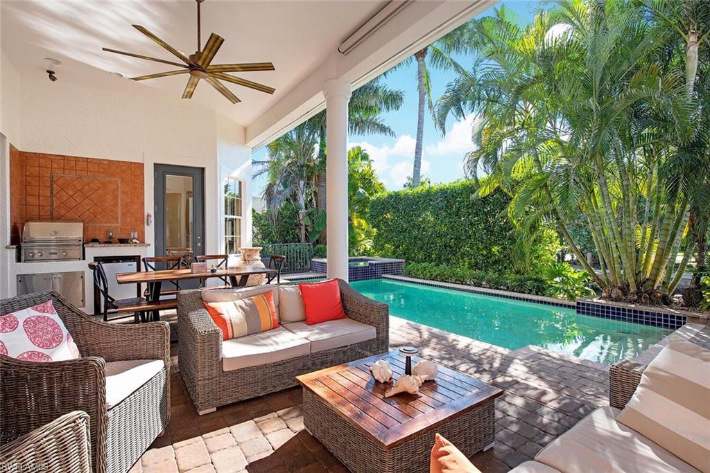 Welcome to 1448 Marlin Dr.  a boaters dream located in the prestigious community of Royal Harbor! This stunning four-bedroom plus den, three-bath residence offers an expansive 3,202 square feet of luxurious living space. Perched at a high elevation, providing peace of mind, complemented by southern exposure, a serene waterfront vista. Enjoy direct access to Naples Bay—perfect for boating enthusiasts, with no bridges obstructing your path to the gulf.

This home features a thoughtfully designed split floor plan, ensuring privacy for family and guests. The flowing open layout is ideal for entertaining, highlighted by glass doors that pocket away to seamlessly to extend your living space to the outdoor oasis. Enjoy the best of Florida living as you step out to your private pool and spa.

Located just minutes from downtown Naples, you'll have convenient access to a vibrant array of restaurants and shopping. End your day with a quiet evening by the water, watching the breathtaking sunsets. Don’t miss the opportunity to experience the ultimate in luxury living at 1448 Marlin Dr.!