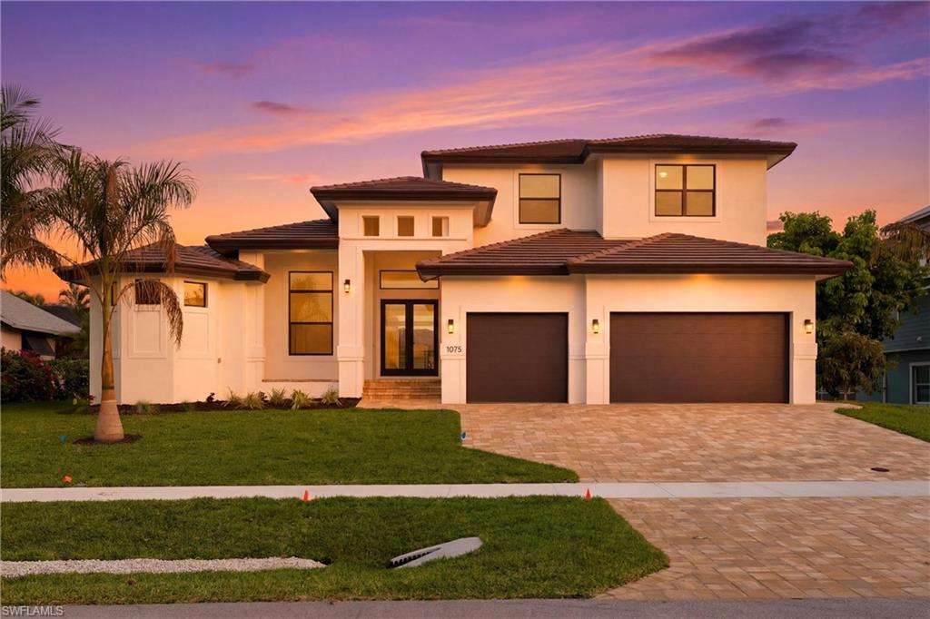 One or more photo(s) has been virtually staged, AI generated or rendered.  WATERFRONT NEW CONSTRUCTION!!!Discover Luxury Island living at this stunning Brand New 5-bedroom, 4.5-bath Waterfront home in Marco Island! With Over 4,500 sq ft under roof and 3,200+ sq ft of air-conditioned living space, this property offers space, style & comfort for family and guests. For those of you who are Boat lovers, Enjoy Gulf Access with only one bridge to navigate & has a 14ft Clearance that is perfect for boating and water adventures. Just 6 blocks from the Private Residents' beach,combines Waterfront views, Island convenience and Luxury Living. This Home has Custom Finishes & Upgrades throughout and is in a Great Location, in the Center of the Island. Southern Exposure & Mesmerizing Sunsets you will enjoy your Screened in Lanai and 2nd Floor Balcony to soak it all in. Now let's head inside where you will get Amazed with all of the Custom Upgrades and Designs.The moment you walk in,you will fall in love with the Fully Pocketed Glass Doors that gives you Full Access and Views to your Screened in Lanai ,Pool and Water Views... The Family Room has a Custom Tray Ceiling with LED lights for the perfect Glow, these lights are also under your Kitchen Island , Below and Above your upper Cabinets too, creating a Beautiful Ambiance at night. The Kitchen is a Chef's Dream with a Spacious Island , Quartz Counter Tops and Matching Backsplash. Upgraded Cabinets and wait til you check out the Hidden Walk In Pantry. Stainless Steel Upgraded Appliances, Induction Cook top and Built in Microwave & Oven to finish it off. Your Dining Area also has Sliding doors to let in all of the Natural Sunlight and Views. Head over to your Main Bedroom Suite Complete with Tray ceiling, 2 Walk -in Closets, Bathroom with Dual Vanity, Soaking Tub and Custom Designed Shower and Upgraded Tiles. 1st Floor Also Features an Office, 2nd Bedroom w/Full Bath that Doubles as POOL Bath from out back,Laundry Room with plenty of Storage, Half Bath & Access to your 3 Car Garage. Head Upstairs & check out the other 3 Bedrooms and 2 more Full Bathrooms. The 5th Bedroom would also make a Great Den & Bedroom Combo, especially when it leads to the Awesome 2nd Floor Balcony, from there the Views of the Island and Sunsets are Breathtaking. As if this was not enough already,  head outside to my Favorite part of the house and your Backyard Oasis. There you will notice all of the Covered Area to Relax and Entertain with your Outdoor Kitchen complete with BBQ Grill, Sink and Granite Countertops, a Heated Pool with Sun Shelf & Spa all in a Screened Enclosure to Finish off this Incredible area. Take this all in while looking out over the canal where you can drop a line to go fishing, draw up plans for a Dock and Boat Lift or just check out the Dolphins, Manatees and Wildlife that stop by your home.  This Home Checks ALL the Boxes -with Location, Waterfront, New Construction & More… All that is missing is You !!!