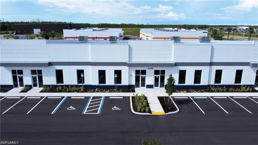 ITEC Flex Space - This 5,530 square foot unit, Class A Flex Space with High-End Features  offers Personal or business air conditioned flex space development located 1.7 mile east of I-75 on Alico Rd. Featuring fully air-conditioned space, fire alarm, suppression systems, glass front entrance, overhead LED lights, included two 14' high x 12’ wide electric roll up door, two ADA bathrooms, Energy-efficient overhead LED lighting. 20' high ceiling and 64' wide , 3-phase electrical panel Fire alarm & suppression system Polished concrete floors ADA-compliant bathroom and wide entry access Modern exterior architecture with premium Location. Highlights: Minutes from Southwest Florida International Airport Surrounded by logistics, tech, and trade businesses Zoned for industrial/flex use with easy truck access This unit can be be split in two separate spaces as well, 2,765 sf each.