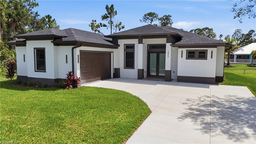 Discover this  luxury living in the highly desirable Buckingham area!  Welcome to this exquisite 2025 brand new home custom-built, with water view thoughtfully designed as a luxurious residential masterpiece, nearly 2,000 sq. ft. of beautifully designed living space featuring 3 bedrooms + a den, 2 bathrooms, and premium upgrades throughout, this home was built to impress. Enjoy soaring ceilings, oversized doors, impact-resistant windows, and luxury tile work extending all the way to the ceiling in the bathrooms. The stunning kitchen boasts stainless steel appliances, a double oven, and modern finishes perfect for both everyday living and entertaining. The spacious kitchen island features elegant quartz countertops, with the same premium quartz material carried throughout all bathroom vanities, creating a cohesive and luxurious design throughout the home. Outside, you’ll find an extended driveway, a stunning outdoor kitchen with beautiful quartzite countertops, ready to use and perfect for entertaining family and friends year-round. The high-quality landscaping, gives this house a plus and plenty of privacy in a peaceful and quiet setting.The garage features elegant epoxy flooring and impact-resistant window, creating a bright, modern space that’s perfect for parking, a workshop, a home gym, or any future project you have in mind, Conveniently located near beaches, airports, shopping, dining, and everything Southwest Florida has to offer. This exceptional Buckingham home combines luxury, comfort, and space—don’t miss your opportunity to make your dream become true.
