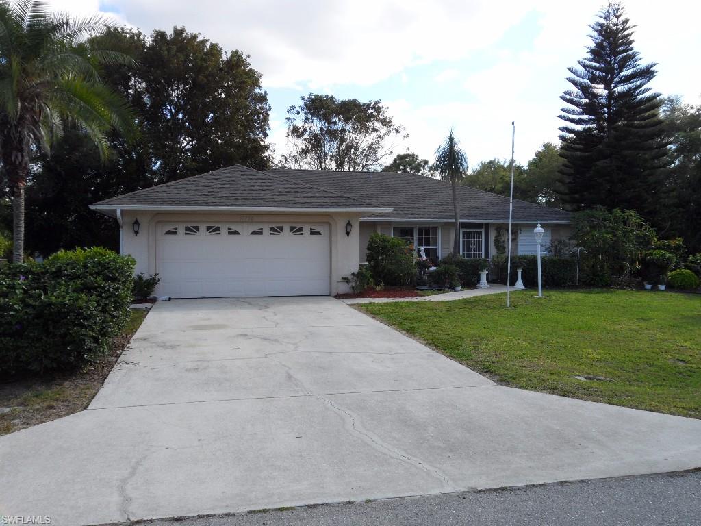 Well maintained three bedroom two bath on a spacious lot! Many varieties of plants, trees and vegetables! Close to the YMCA and the Livingston extension making it a short ride to Coconut Point Mall and beaches! Electric hurricane shutters installed and the hot tub on the lanai stays! New roof in 2006 and the furniture is negotiable. Buyer to assume sewer assessment.