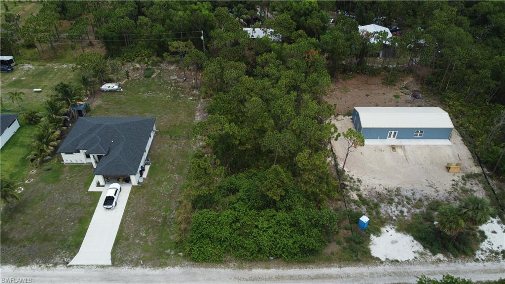 Discover the perfect place to build your dream island home on this beautiful private ½-acre lot in the heart of Bokeelia. Tucked away in a quiet, rural setting at the end of the street, this wooded parcel offers privacy, tranquility, and the laid-back island lifestyle Pine Island is known for. Located in an X flood zone, flood insurance is not typically required by lenders, adding even more value to this exceptional property.

Enjoy easy access to everything that makes Bokeelia special. Just minutes from Pineland Marina, Four Winds Marina, public boat ramps, Alden Pines Golf Course (reopening Fall 2026), local fruit markets, shopping, and the famous Tarpon Lodge Restaurant. Spend your days boating to Pine Island Sound, Boca Grande Pass, Cayo Costa, Cabbage Key, and the Gulf of Mexico, where world-class fishing, shelling, and white sand beaches await.

With no HOA restrictions, plenty of room for your custom home, tropical landscaping, and all your toys, the possibilities are endless. Whether you’re looking for a peaceful full-time residence, seasonal getaway, or investment opportunity, this property offers the perfect blend of natural beauty, privacy, and convenience. Come experience the true island lifestyle in beautiful Bokeelia!