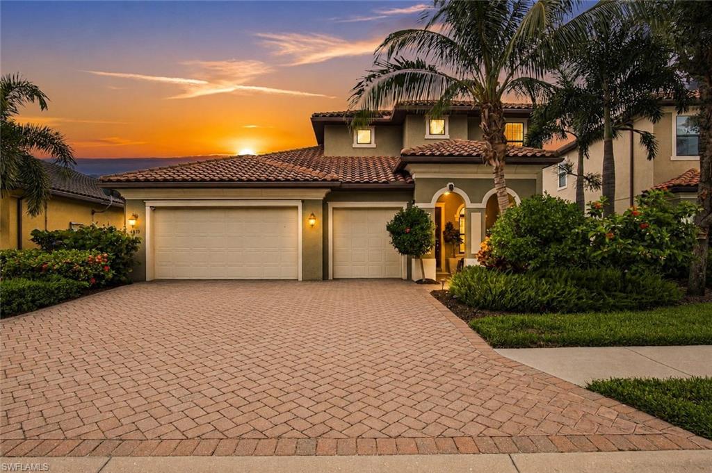 Experience the perfect blend of timeless WCI craftsmanship, flexible living, and resort-style luxury in this beautifully appointed lakefront Genoa II residence within the sought-after gated community of Raffia Preserve. Offering 3,388 sq. ft., this spacious home features 3 bedrooms + den, an oversized upstairs bonus loft with its own HVAC system, 2 full baths, a private pool and spa, and an expanded 3-car garage. Perfectly positioned on the desirable northern loop of Tamarind Way, this premium western-exposure homesite captures spectacular sunset views across the lake from the screened lanai. Raffia Preserve spans 184 acres, including 72 acres of protected natural preserves, creating a tranquil setting just minutes from Naples' finest conveniences. Designed for effortless entertaining, the open-concept floor plan showcases large-format porcelain tile throughout the main living areas, baths and den, new luxury vinyl plank flooring in the primary suite, plush carpet in guest bedrooms and loft, fresh interior paint, 8-foot doors, impact-resistant windows and doors, and custom cabinetry throughout. The gourmet kitchen is the heart of the home, featuring KitchenAid stainless appliances, double wall ovens, 42-inch cabinetry, genuine exotic leathered stone countertops, an oversized two-tier island, and a generous walk-in pantry. Triple-panel impact glass sliders seamlessly connect the great room to your private outdoor oasis, where the pool and spa are controlled from inside the home. The expansive lanai offers ample space for lounging, entertaining, and the future addition of a custom outdoor kitchen. The luxurious primary suite features Alexa-controlled motorized blackout shades. A standout feature is the expansive upstairs loft, measuring 25'10" x 17'5" and offering exceptional flexibility as a media room, game room, teen retreat, fitness studio, home office, in-law suite, or potential fourth bedroom with space to add a future full bath. The oversized 3-car garage, abundant storage, wide paver driveway, and generous parking provide room for hobbies, guests, and everyday convenience. Low HOA fees include access to exceptional amenities featuring a resort-style clubhouse, zero-entry pool with lap lanes, 2,000-square-foot fitness center, basketball court, playground, and beautifully maintained grounds. Located within an A-rated school district and walking distance to Galleria Shoppes at Vanderbilt, Oakridge Middle School, and the new Mason Classical Academy campus. Just minutes to Founders Square, Pebblebrooke Plaza, world-renowned Gulf beaches, fine dining, shopping, entertainment, NCH, and Physicians Regional Medical Center. Flood Zone X500 means flood insurance is not currently required. Whether you're searching for a full-time residence, seasonal retreat, or investment opportunity, this exceptional WCI-built home delivers premium construction, an outstanding location, resort amenities, and the quintessential Naples lifestyle.