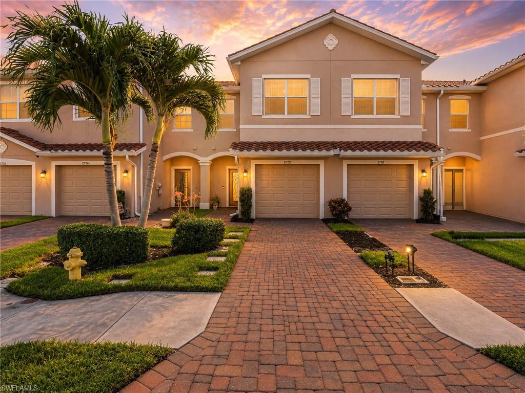 One or more photo(s) has been virtually staged, AI generated or rendered.  Nestled in the secure, gated community of Orange Blossom Ranch in Northeast Naples, this exquisite 2020 townhome offers 1,879 square feet of modern comfort, featuring 3 bedrooms, 2.5 bathrooms, and a thoughtfully designed layout. The heart of the home is a chef’s delight kitchen adorned with granite countertops, ample cabinetry, and stainless steel appliances, which flows seamlessly into a bright, open-concept living space and out to a private, screened-in lanai. Upstairs, the master suite serves as a true retreat, boasting two oversized walk-in closets and an en-suite bathroom with a dual vanity, a private water closet, and a sleek glass-enclosed shower. This family-friendly and pet-friendly neighborhood is tailored for an active lifestyle, offering an impressive array of resort-style amenities just steps away, including a clubhouse, a fitness center, two swimming pools, a playground, tennis court, and pickleball courts. Situated in a rapidly growing, up-and-coming corridor of Naples, the surrounding area is booming with vibrant new developments, shopping, and dining options, all while being conveniently located near top-rated schools. This property is the perfect blend of modern luxury, community, and future value—don't miss your chance to claim this incredible slice of Naples paradise!