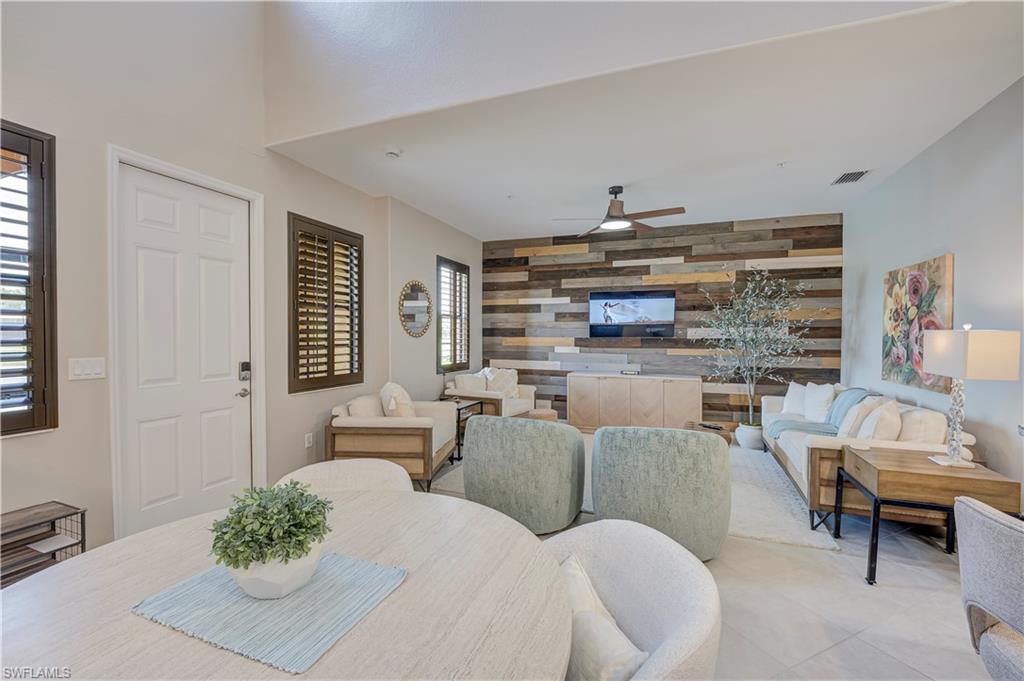 LOCATION, LOCATION, LOCATION, Experience the ultimate Southwest Florida lifestyle in this beautifully maintained Santa Isabella model townhome located in the award-winning Paseo community, proudly recognized as Community of the Year for nine consecutive years. Built in 2016, this exceptional 2-bedroom, 2.5-bath residence offers the perfect blend of comfort, style, and convenience with an open-concept floor plan designed for effortless everyday living. The gourmet kitchen features stainless steel appliances, 42-inch dark wood cabinetry, elegant granite countertops, and overlooks the spacious living and dining areas, creating an ideal setting for gathering with family and friends. Upstairs, both generously sized bedrooms offer privacy and comfort, including a spacious primary suite with an oversized walk-in closet complete with built-in shelving for exceptional organization. A versatile office space with an expansive built-in desk comfortably accommodates two workstations, making it perfect for remote work or creative pursuits.

Step outside to your private screened lanai overlooking a tranquil lake, or take a short stroll to Paseo’s spectacular Village Center, where resort-style amenities create a true year-round vacation atmosphere. Residents enjoy a sprawling lagoon-style pool, lively Tiki Bar, sports pub, state-of-the-art fitness and wellness center, 70-seat movie theater, Har-Tru tennis courts, pickleball, bocce, sand volleyball, basketball courts, playground, library, full-service spa and salon, coffee shop, bistro, and even an ice cream parlor. Ideally located near Southern Fresh Farms and just minutes from shopping, dining, beaches, and Southwest Florida International Airport, this home is equally appealing as a full-time residence, seasonal retreat, or investment opportunity with excellent rental potential. Don’t miss your chance to own a piece of one of Fort Myers’ most sought-after resort communities.