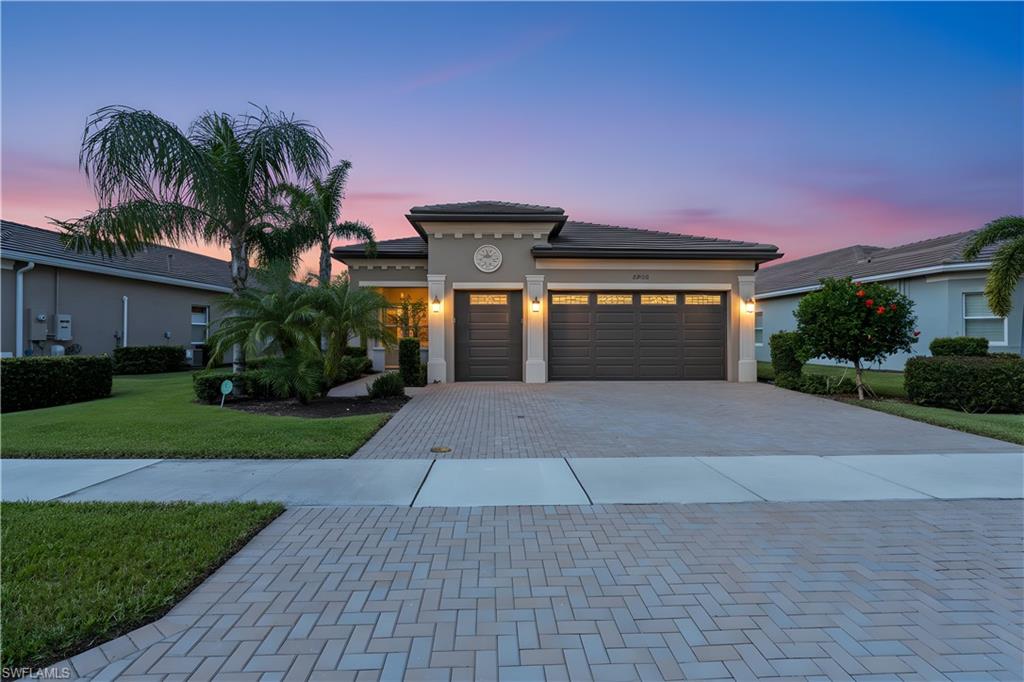 Wake to golden light spilling across peaceful preserve views and the refined elegance of your Cabernet model home. Located within the gates of Valencia Bonita—Southwest Florida’s premier 55+ luxury community—this 3BR+den, 2BA, 3-car garage residence blends sophistication, comfort, and connection. Begin your day in the gourmet kitchen, where quartz countertops, custom cabinetry, and premium appliances inspire both everyday living and effortless entertaining. Enjoy peace of mind with impact-resistant doors and windows, offering security, energy efficiency, and quiet tranquility. Spend afternoons at the 45,000-sq-ft clubhouse—whether playing pickleball, swimming, or unwinding in the fitness center—then return home to your screened lanai and southwest-facing sunset views. A split-bedroom floor plan ensures privacy, while the den invites creativity or quiet retreat. More than a home—it’s a gateway to a vibrant, resort-inspired lifestyle.