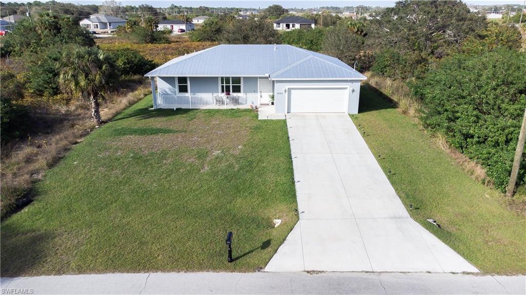Seller Motivated!! Huge price drop….NOT your average cookie cutter type home.  This recently built home features upgrades most do not have.  Upgrades include a Metal Roof, Luxury Vinyl Plank Flooring (No carpet in the home), Ceiling upgrades to 9.4 inches tall, custom window treatments and an extra long driveway for added parking.  As you walk up to the home you are welcomed by the covered porch where you can sit and enjoy your morning coffee or a glass of wine.  The home is open and spacious and has a great floor plan.  There is a green belt behind the home so no one will be building behind you.  This home shows pride of ownership and you won’t be disappointed.  Show and sell today!!