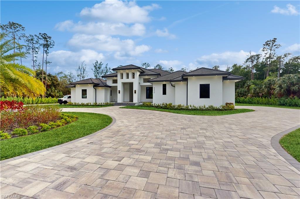 Nestled in the highly sought-after Oakes Estates, this spectacular 5-bedroom, 5.5-bathroom home sits on an expansive 2.73-acre lot and offers unparalleled luxury, comfort, and convenience. Designed for ultimate relaxation and grand entertaining, this residence features exceptional living spacesand exquisite craftsmanship throughout.
The home boasts a spacious master suite and a secondary suite that can be used as a separate primary bedroom The master bathroom is truly a spa-like retreat with a 140-gallon air bath for ultimate relaxation.
Entertaining is effortless in the breathtaking kitchen and adjacent open-concept living spaces. The home includes Italian ceramic tile flooring, a whole-house generator, home automation system, and over 40 built-in speakers for an immersive audio experience.
Step outside into the expansive outdoor oasis featuring a resort-style pool with multiple streamers, waterfalls, and a stunning 10’ linear gas fire feature at the rear – perfect for evening gatherings. The outdoor kitchen includes a 42” barbecue grill, built-in smoker, refrigerator, and ice machine – ideal for hosting guests in style.
The home also features a custom-built den with an ice machine and double beer taps, along with a walk-in wine room that can store up to 900 bottles of your favorite vintages.
This is a home that combines luxury, entertainment, and comfort in one of Naples' most exclusive neighborhoods. Whether you're hosting large gatherings, enjoying family time, or simply relaxing in your private sanctuary, this home is designed for every occasion.