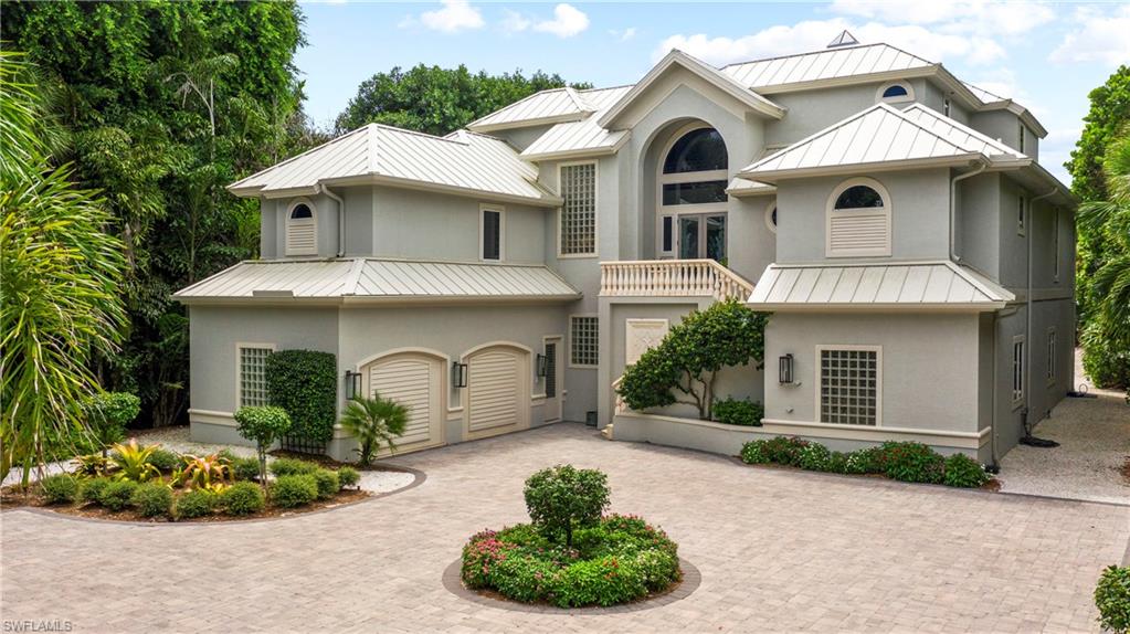 Direct Gulf Front on West Gulf Drive! Walk right out to the beach from the large veranda with an outdoor kitchen or to the pool area with lush vegetation. Features include a 2-story great room that opens to the designer kitchen w/granite countertops, center island & custom cabinetry. The master suite is also located on the main floor and offers walk-in closets, a sitting area & a beautifully appointed bath. A large office, laundry room, full bath & the elevator are located on the other side of the first floor making this home easy living on one floor. The 2 spacious guest suites are upstairs & both have views of the Gulf & open to a rooftop sundeck. Also on the second floor is a morning kitchen, separate nursery/sitting room & washer/ dryer for guests. This home has been meticulously maintained & is ideal for the most discerning Buyer. Offered fully furnished with fine art & accessories. This is a terrific turnkey opportunity!