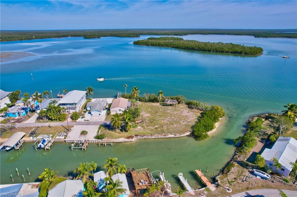 RARE WATERFRONT OPPORTUNITY IN HISTORIC GOODLAND, FL!  Discover the ultimate waterfront lifestyle with this incredible opportunity to purchase this property, along with adjacent property, combing over half an acre of prime Real Estate, in the heart of Goodland. This laid-back Island community is renowned for its world-class fishing, waterfront dining, and Old Florida charm. Build you dream home and enjoy breathtaking water views, direct Gulf access, and endless boating adventures. For those seeking even more space, 103 Bayshore Way is also available, providing the opportunity to own nearly .75 of an acre of premium waterfront property. Don't miss this rare chance to create your own private paradise in one of Southwest Florida's most sought-after coastal destinations. Value of this property is in the land, no value given for the dwelling on the property.