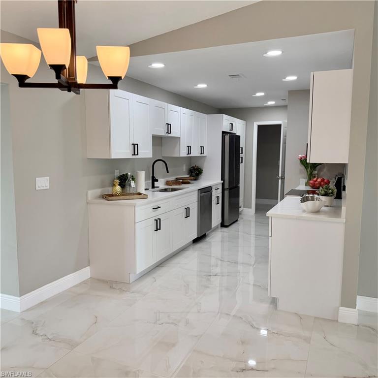 Location... Location in the highly desirable Golden City, this absolutely stunning, like-new residence offers  modern elegance, and a beautifully renovated interior situated in the heart of Naples.
As you enter through the front door, you are welcomed by an elegant  living room and dining room, leading into a spectacular open-concept kitchen and spacious family room — perfect for entertaining and everyday living. The kitchen features large white cabinetry, gorgeous white quartz countertops, and brand-new stainless steel appliances.
This beautifully renovated home offers 4 bedrooms, 3 bathrooms, and a large family room with an inviting and functional layout. Recent upgrades include fresh interior paint with 2022 metal roof and 2024 Air condition.
The home shows gorgeous porcelain tile flooring throughout and beautifully designed modern bathrooms.  Plenty of space to build your dream pool and create your own private outdoor oasis in the future.
Ideally located in Golden Gate City, this property offers close proximity to shopping center, schools, restaurants, Naples’ beautiful beaches, and quick, convenient access to I-75. This move-in-ready home combines comfort, style, and location in one exceptional property.