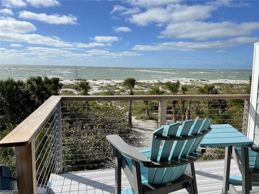 MOTIVATED SELLER BRING YOUR OFFERS! PRIME ISLAND OFFERING! EXQUISITE PRIME ISLAND BEACH FRONT REMODELED TOWNHOME “OCEAN WAVES”! Boat Slip with Covered Lift for sale additional with this home purchase. 26FT Maximum Boat Size and 10,000 LB Covered Boat Lift please inquire! FANTASTIC VACATION RENTAL or GULF FRONT HOME! This High End, Newly Remodeled, Gulf Front AND Beach Front Townhouse makes up one half of this Duplex Property. This Turnkey Villa offers Two Main Owner Suites and Two Full Baths. It has undergone Gorgeous and Extensive Renovations and offers Breath Taking Views of the Gulf of Mexico from its Deck, Porches, and Balcony! Aside from the Elegant Brand Open New Kitchen with Huge Breakfast Bar, Upscale Baths, Appliances, Flooring, Electrical, Fixtures, Fans, Finish Carpentry, Paint, Electric Fireplace, and Turnkey Furnishings, this Amazing Property has a Brand New Metal Roof, Hardie Board Siding, Impact Windows and Doors, New Whole House Reverse Osmosis Water System, Railings, Stairs, and more. This Turnkey Furnished Villa has Fantastic Rental History and Potential gearing up for a busy Florida Winter Season. Located directly on the Wide Butterfly Beach on the Barrier Island of North Captiva with Private Beach Access. The property's Shoreline provides an Abundance of the Finest and Most Beautiful Shells and its' Gulf Waters offers World Class Fishing! The Islands State Nature Preserve is also only Steps Away. The Islands Sea and Wildlife are magnificent to Enjoy! An Island Club at North Captiva Memberships is available please inquire to enjoy their Pools, Spa, Kayaks, Fat Tire Bikes, Basketball, Activities and Island Services etc. Professional Licensed Property Mgmt with Upcoming Rentals is already in place should you choose to Enjoy Your Townhomes and/or Value its’ Rental Income! This is a Must See Property Located Directly on the Beach. Tropical and Lush, this Duplex sits in a Spectacular Location on Island. *The Entire Duplex is also currently for available for sale. Ask Agents about Unit 3! Rare is this Unparalleled Opportunity to Own an Entire Gulf Front and Beach Front Luxury Duplex in a Spectacular Location on Butterfly Beach!