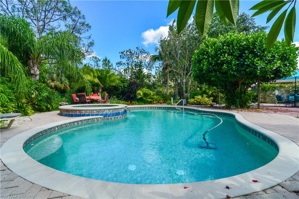 Epitome of outdoor living this move in ready home enjoys the privacy of backing up to a preserve, expansive covered lanai with pine ceilings, beautiful exotic tropical landscaping with a Lychee fruit tree, easy to care for tranquil koi pond, a relaxing heated pool and spa, fenced for your furry family and plenty of space for dining al fresco. Ideal layout includes open floor plan, lanai entry and outdoor views from kitchen/sitting room, living room and master bedroom, extra-large split bedrooms and indoor air conditioned laundry room with tub. Kitchen features stainless steel appliances and is great for entertaining  with plenty of island space. Dishwasher & pool heater replaced in 2018 plus exterior painted in 2017. Eagle Ridge is highly sought after boasting low HOA fees of $279 per year with an ideal location in the heart of Ft. Myers. Airport, shopping, restaurants, entertainment and world class beaches are all a short drive away.  If you enjoy Baseball Spring Training Camp of the Minnesota Twins and the Boston Red Sox are also very close! This gem will not last long- get in to see it today! Eagle Ridge Golf is public, and is one of the best golf values in the area.