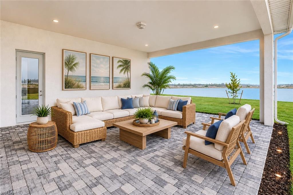 One or more photo(s) has been virtually staged, AI generated or rendered.  Experience elevated southwest Florida living in this stunning new construction lakefront pool home located within the highly sought-after gated community of Seven Shores in south Naples. Perfectly positioned on a premium waterfront homesite with a desirable southern-exposure backyard, this luxurious two-story residence showcases breathtaking water views throughout and exceptional indoor-outdoor living. Designed for both entertaining and everyday comfort, the expansive open-concept floor plan features 4 bedrooms, 4 full baths, a private office, spacious loft, versatile flex room, and elegant formal dining area. The heart of the home flows seamlessly to an impressive outdoor retreat complete with a covered lanai, screened pool and spa, and serene lake views that create the ultimate Florida lifestyle. Built with today's latest construction standards and backed by a builder warranty, this home offers peace of mind along with sophisticated design. Residents of Seven Shores enjoy access to an exceptional amenity center featuring resort-style amenities, recreation, and social activities, all just minutes from the best of south Naples dining, shopping, beaches, and entertainment. Luxury waterfront living awaits. See MLS supplements for interior design selections. Home Site 347